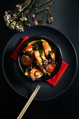 Salad with avocado and shrimps in bowl, top view. Restaurant table setting.