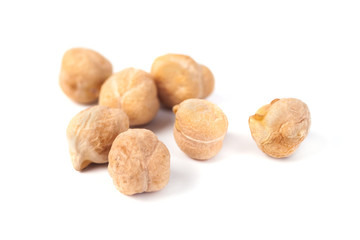 Dry raw organic chickpeas isolated on white background