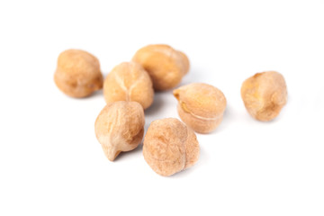 Dry raw organic chickpeas isolated on white background