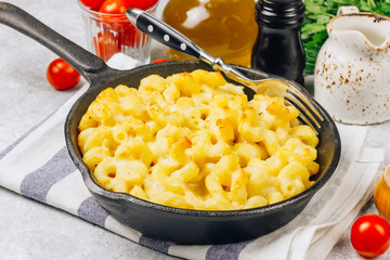 Mac and cheese, american style macaroni pasta with cheesy sauce