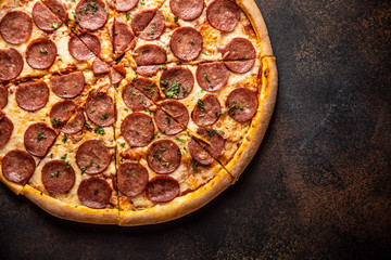 Pizza pepperoni on wooden table close up