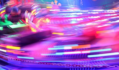 disco lights synthwave neon fairground ride night lights funfair light trails, slow shutter-speed long exposure illuminations futuristic sci fi stock, photo, photograph, picture, image - Powered by Adobe