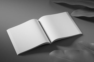 Side view of an empty white unfolded book on a black background with tropical flowers. Mock up. 3d rendering