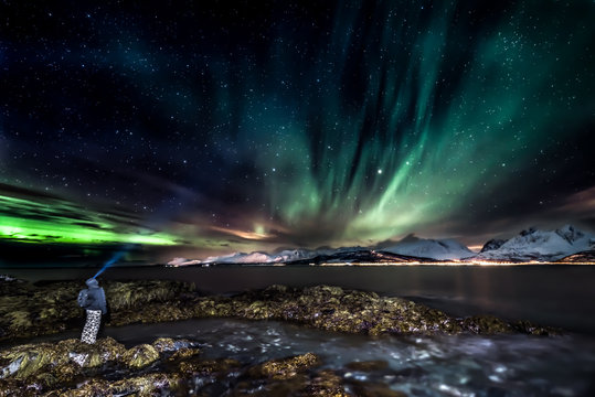 Amazing aurora borealis - northern lights - view from coast in Oldervik, near Tromso city -  north Norway