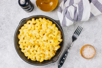 Mac and cheese, american style macaroni pasta with cheesy sauce