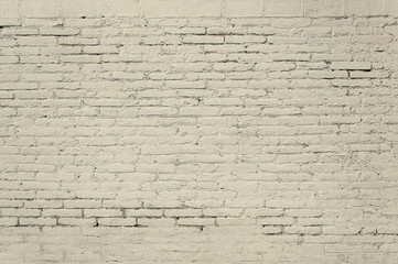 Old brick wall with grey paint background texture