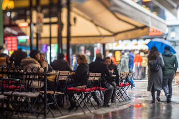 Sidewalk cafe in the rain
