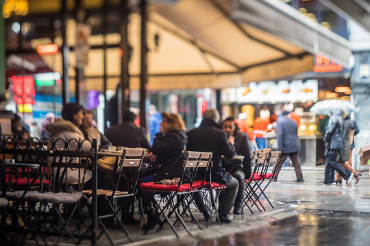 Sidewalk Cafe In The Rain