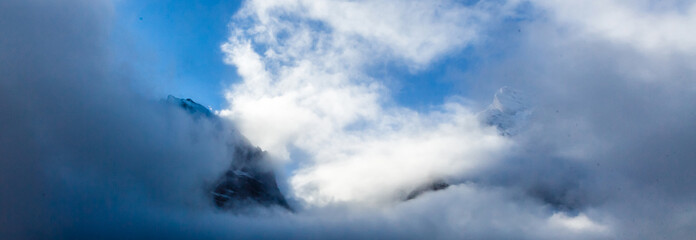 Beautiful autumn time at village of Lauterbrunnen in Swiss alps, gateway to famous Jungfrau. Set in a valley featuring rocky cliffs and the roaring