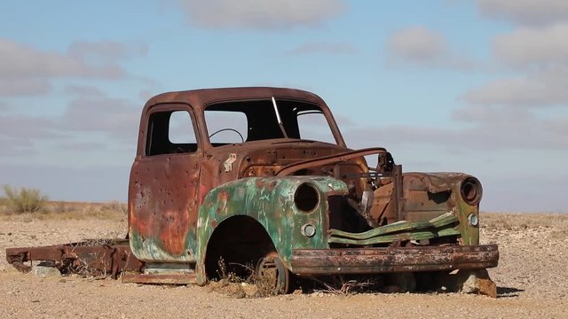 Old vintage car wreck interior in Namib desert Southern Namibia arid landscape 