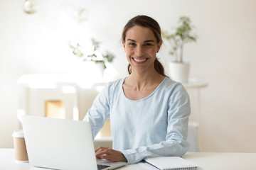 Successful self employed woman posing looking at camera