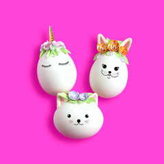 Unicorn, bunny and cat made of eggs. Easter concept