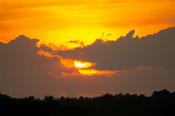 Sunset is behind the clouds.