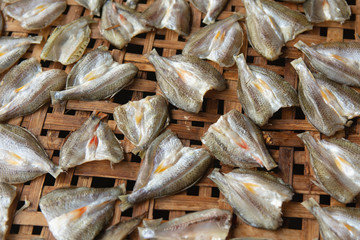 Dried fish on Bamboo sieve with sunny