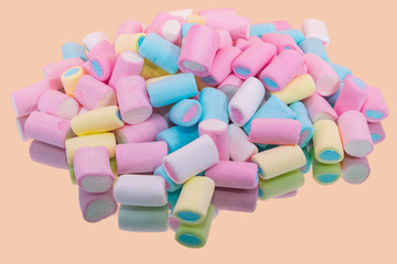 Colorful marshmallow on a mirror