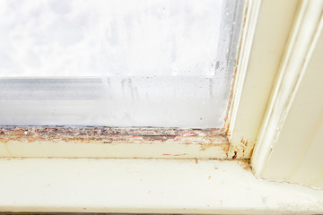 Old Wooden Window in Need of Replacement in Home