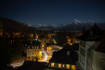 Night view Thun with Swiss alps in the background