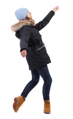 Side view of a woman dancing ballet. The girl is balancing.