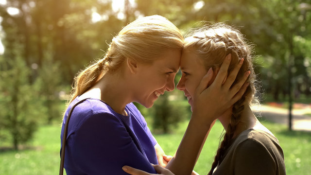 Mother Looking At Her Pretty Daughter With Love And Tenderness, Awkward Age