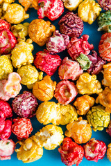 multi-colored popcorn on a bright background.concept of cinema,copy spase
