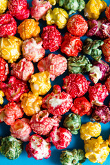multi-colored popcorn on a bright background.concept of cinema,copy spase