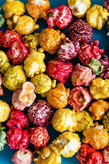 multi-colored popcorn on a bright background.concept of cinema,copy spase