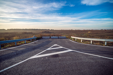 closed road turn. unfinished road