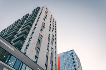 Obraz premium modern office building in sunset time, building facade 