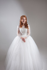 Happy young woman bride in a lavish wedding dress.