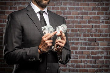 Corrupt man holding bills of money