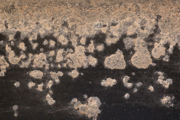 Corrosion on black painted metal with salt build up
