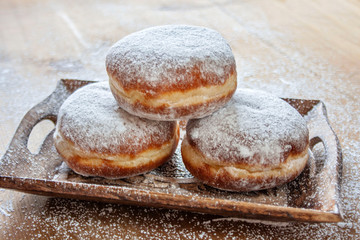  Donuts on a wooden tray