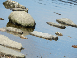Fototapeta na wymiar Rocks on the shore at Glendalough in Wicklow Mountains
