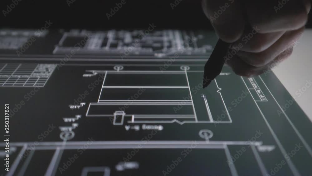Wall mural designer architect using creative pen display tablet working with drawings at night. drawings on the