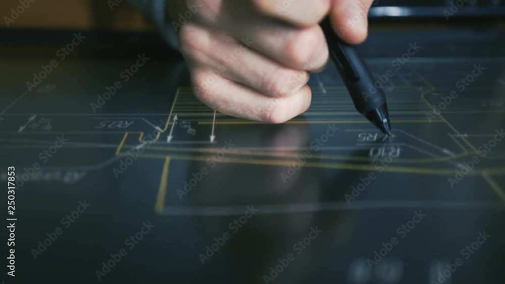 Wall mural designer architect using creative pen display tablet working with drawings in night office. drawings
