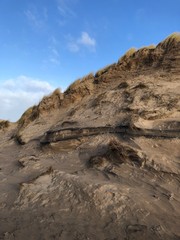 Grassy, Sandy Hills against Blue Sky