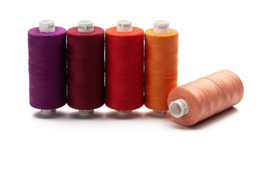 Multicolored threads spools isolated