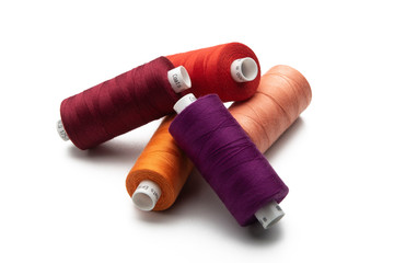 Multicolored threads spools isolated