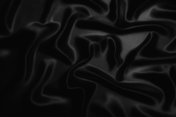Obraz premium black abstract background luxury cloth or liquid wave or wavy folds of grunge silk texture satin velvet material or luxurious Christmas background or elegant wallpaper design, background