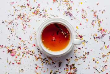 Cup of tea with lavender leaves and petals