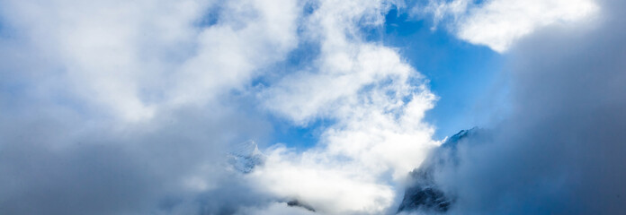 view of a valley in a beautiful early morning with fog between hills