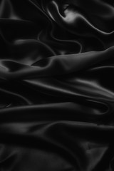 Fototapeta premium black abstract background luxury cloth or liquid wave or wavy folds of grunge silk texture satin velvet material or luxurious Christmas background or elegant wallpaper design, background