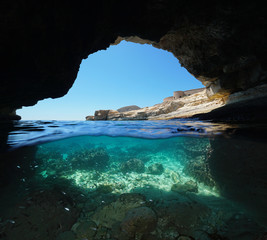 Inside a cave on the seashore, split view half over and under water, Mediterranean sea, Spain, Cabo...