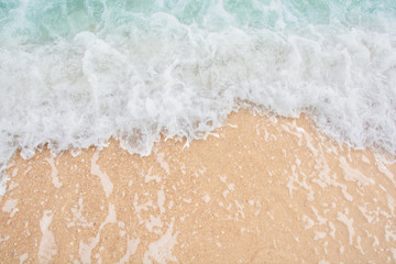 Soft wave of sea on empty sandy beach Background with copy space