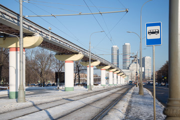 Rails for tram in tram near the bridge in the city on winter time