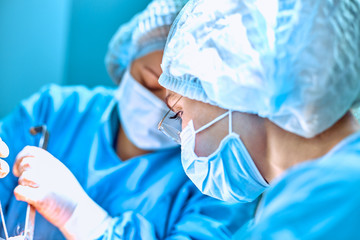Fototapeta premium Surgeons team working in the hospital, operating room