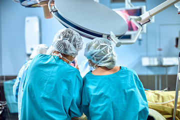 Surgeons team working in the hospital, operating room