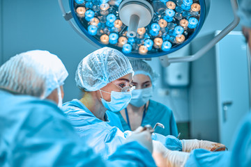 Surgeons team working in the hospital, operating room