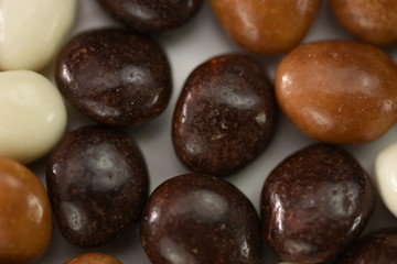 Dark ,white,brown dragee in chocolate 