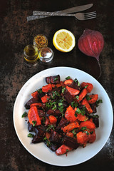 Salad of baked beets, pumpkins and carrots. Warm salad of winter vegetables. Healthy vegan salad with baked vegetables. Beet salad with pumpkin and carrot.